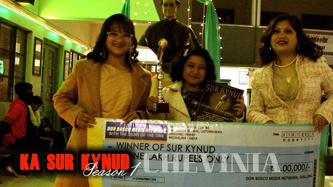 Chevinia, Season 1 winner, with her trophy and cheque
